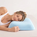 Side sleeper resting on a light blue CASUCA contour memory foam pillow