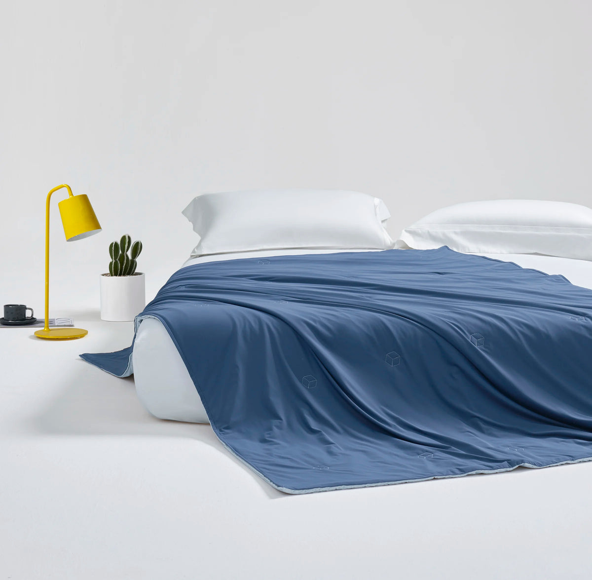 Full view of the Prussian blue CASUCA cooling comforter