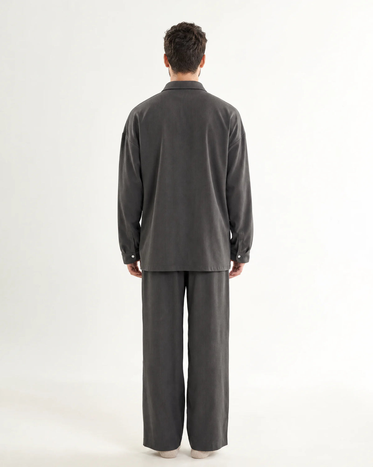 Back view of a woman wearing the grey CASUCA pet-hair-resistant loungewear set