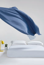 Prussian blue CASUCA cooling comforter displayed against a light background