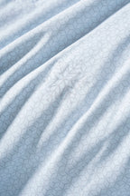Close-up of the reverse-side texture of the Prussian blue CASUCA cooling comforter
