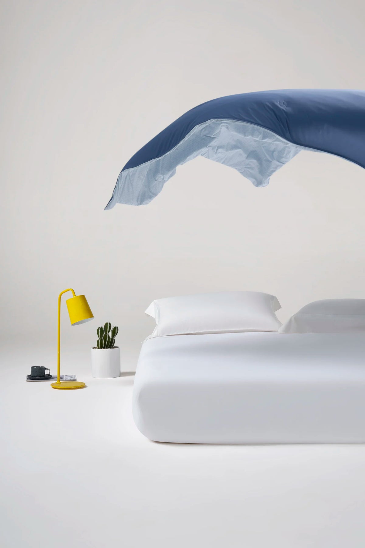 Reversible Prussian blue CASUCA cooling comforter showing both sides