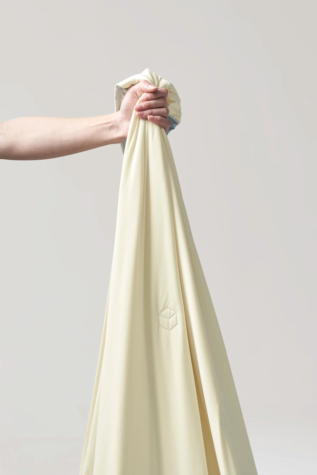 Close-up showing the soft surface of the banana milk yellow CASUCA cooling comforter