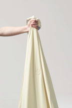 Close-up showing the soft surface of the banana milk yellow CASUCA cooling comforter