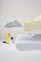 Reversible banana milk yellow CASUCA cooling comforter showing both sides