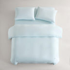 blue CASUCA cooling pet-hair-resistant bedding set styled in a pet-friendly bedroom