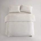 oatmeal CASUCA cooling pet-hair-resistant bedding set styled in a pet-friendly bedroom