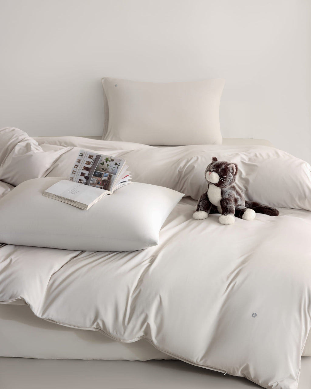 oatmeal CASUCA cooling pet-hair-resistant bedding set styled in a pet-friendly bedroom