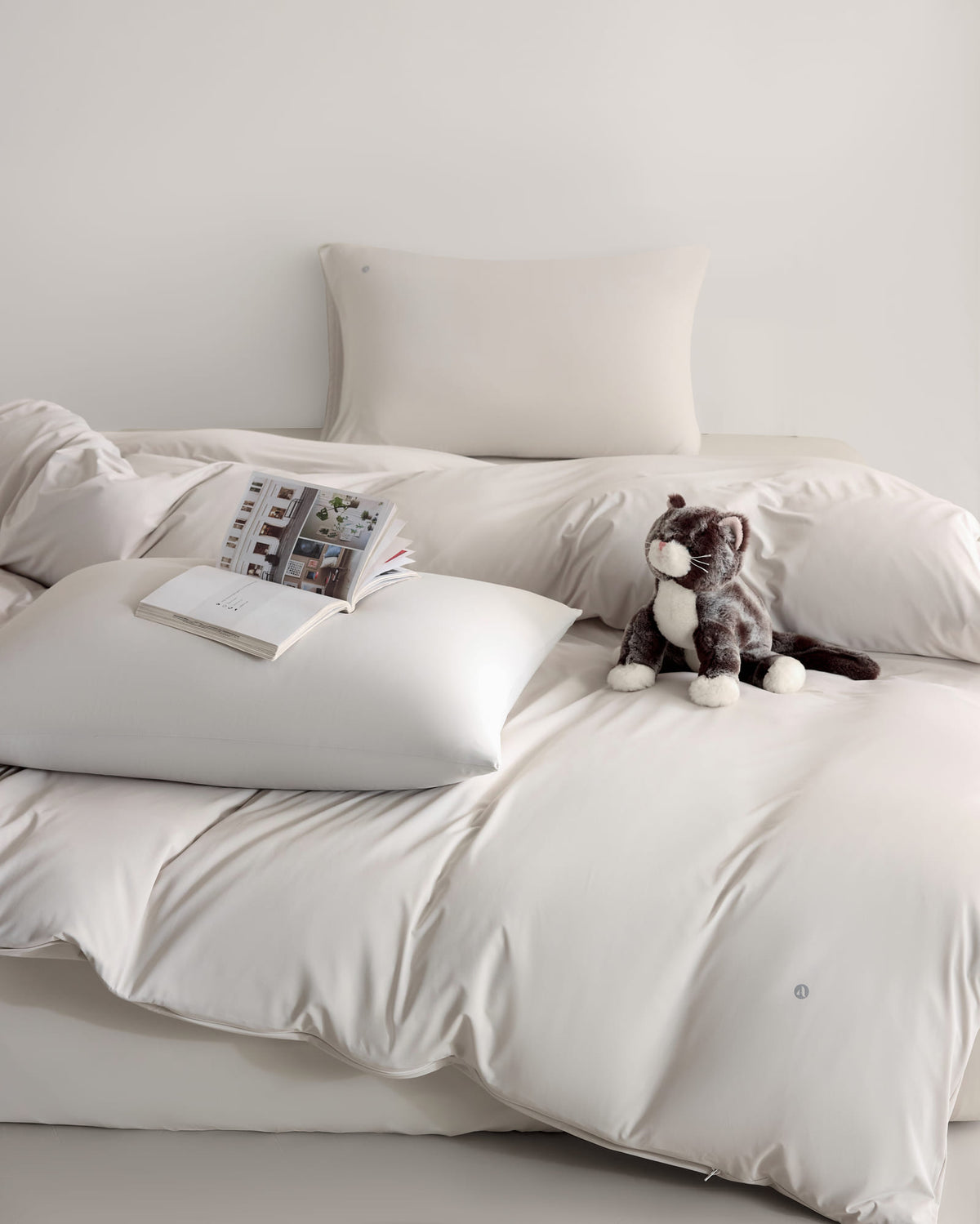 oatmeal CASUCA cooling pet-hair-resistant bedding set styled in a pet-friendly bedroom