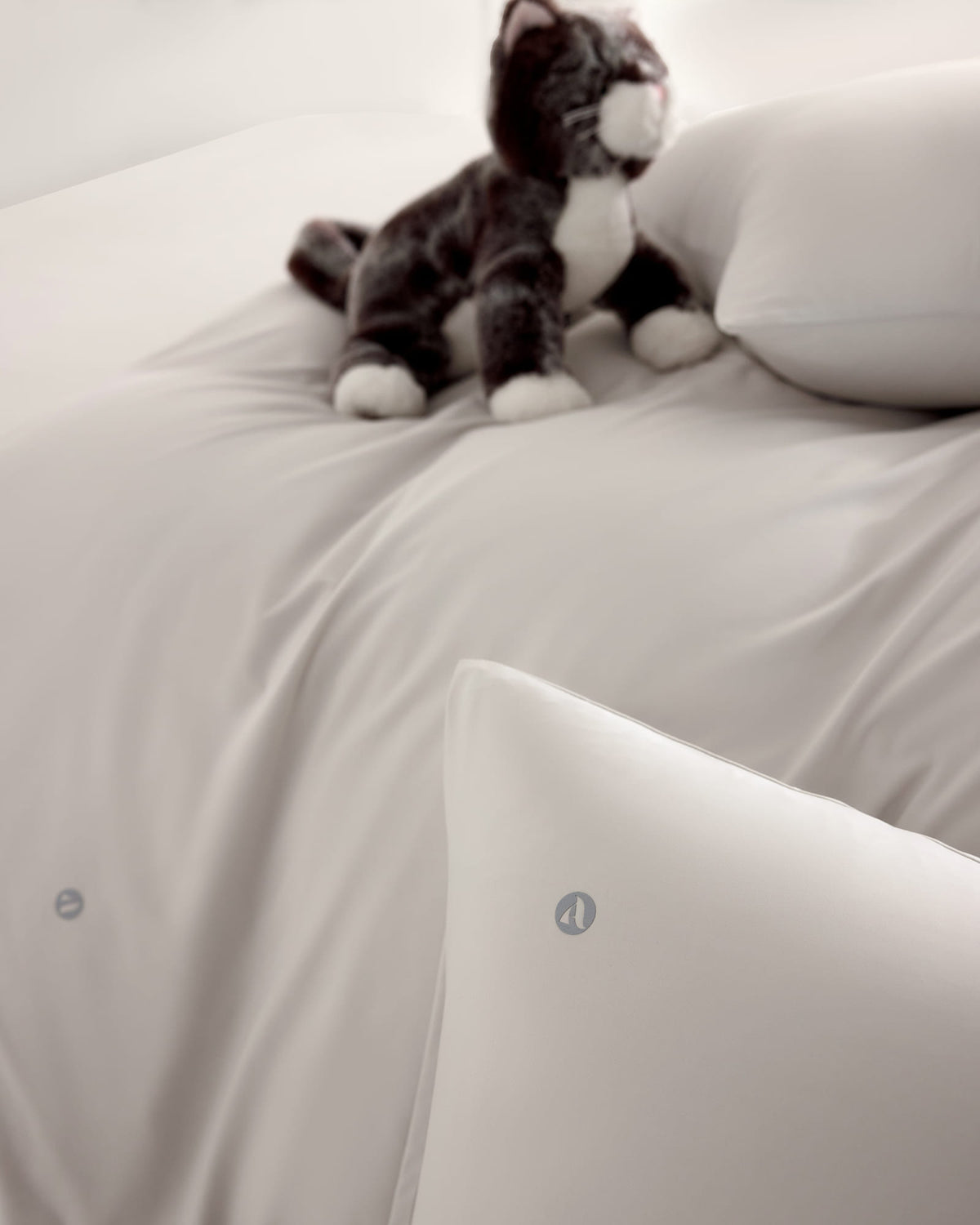 oatmeal CASUCA cooling pet-hair-resistant bedding set styled in a pet-friendly bedroom