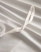 Duvet corner tie detail on the oatmeal CASUCA cooling pet-hair-resistant bedding set