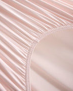 Fitted sheet elastic detail on the pink CASUCA cooling pet-hair-resistant bedding set