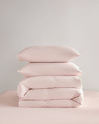 Folded pink CASUCA cooling pet-hair-resistant bedding set
