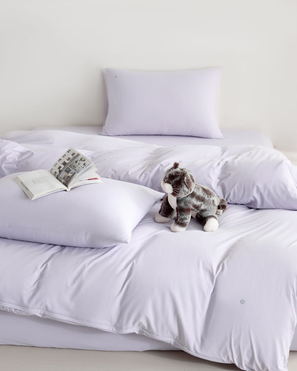 purple CASUCA cooling pet-hair-resistant bedding set styled in a pet-friendly bedroom