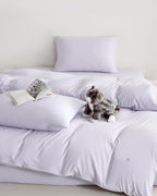 purple CASUCA cooling pet-hair-resistant bedding set styled in a pet-friendly bedroom