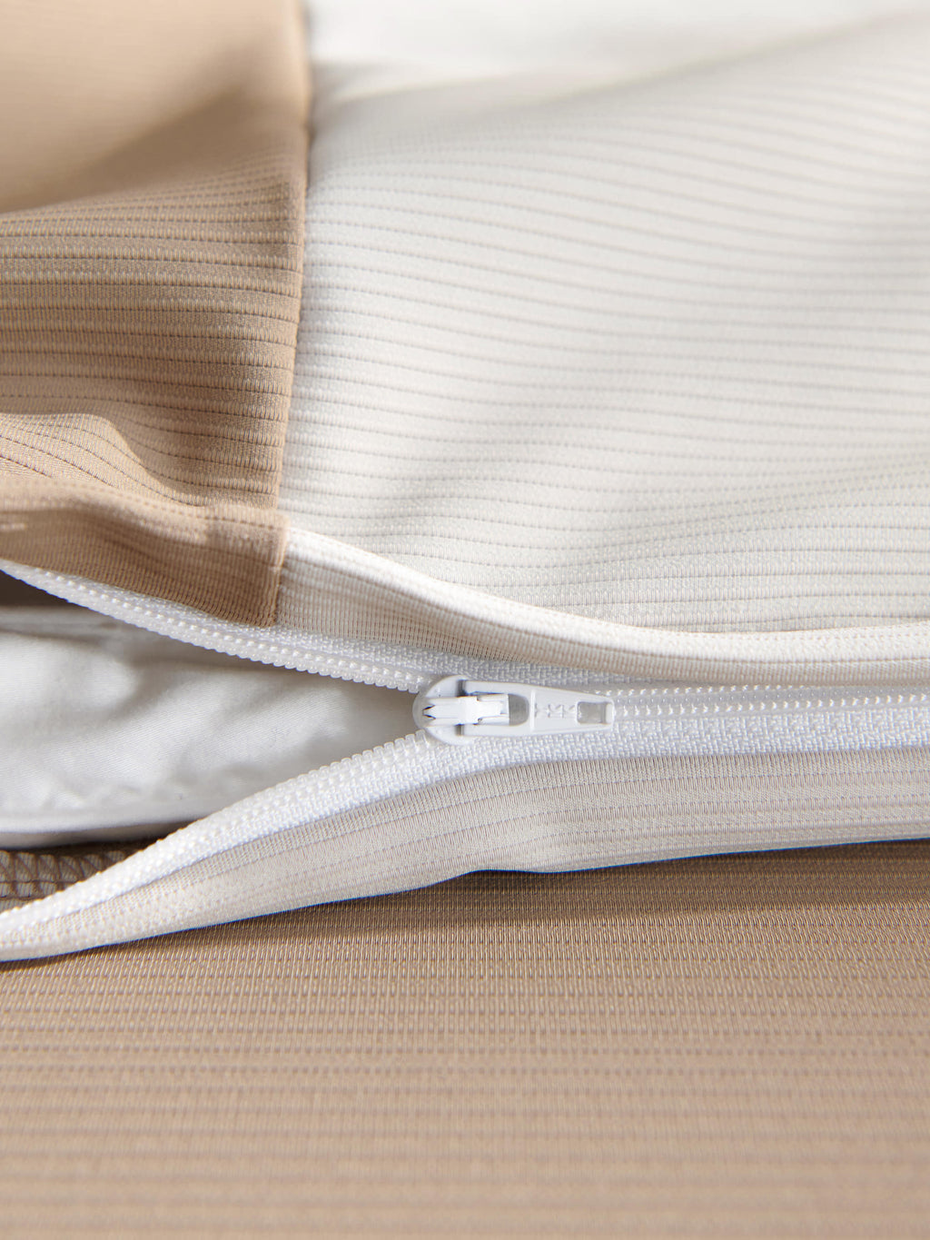 Concealed zipper detail on the brown Peecatboo pet-hair-resistant four-piece bedding set