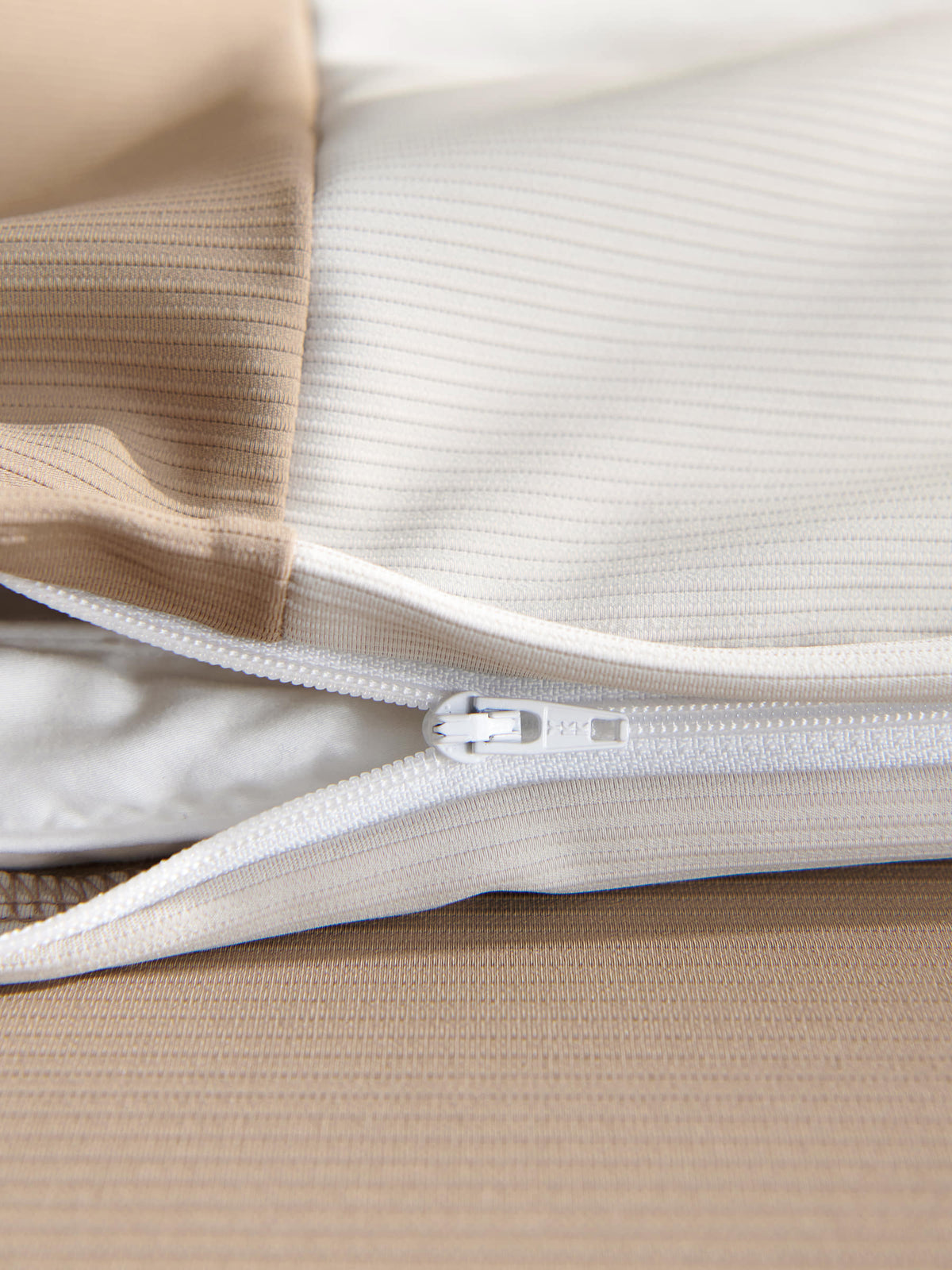 Concealed zipper detail on the brown Peecatboo pet-hair-resistant four-piece bedding set